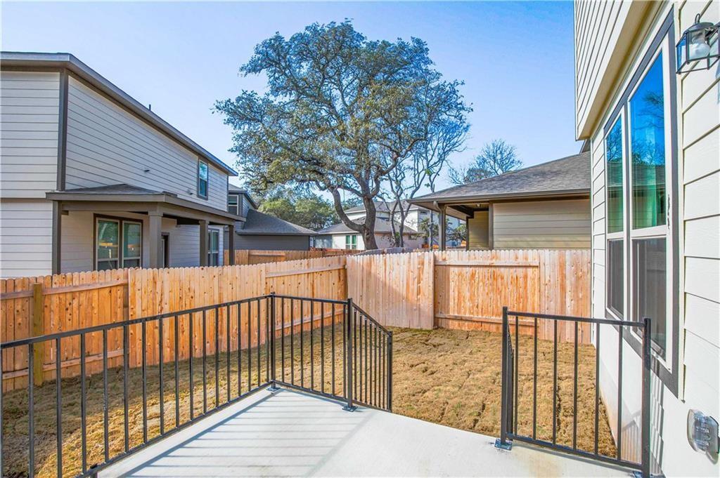 1616 Turtle Bay Loop Leander, TX 78641 - Photo 14 of 33 a view of a house with a wooden fence