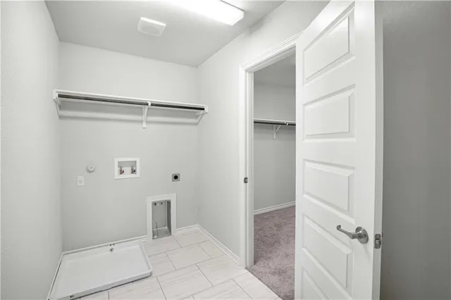 a view of hallway with wooden floor
