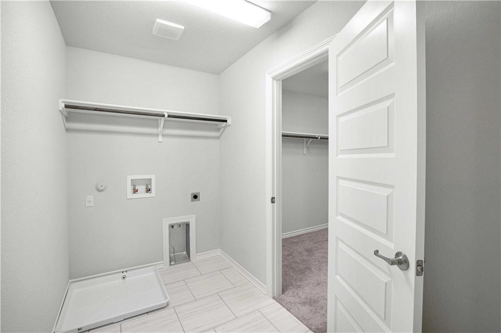 1616 Turtle Bay Loop Leander, TX 78641 - Photo 20 of 33 a view of an empty walk in closet