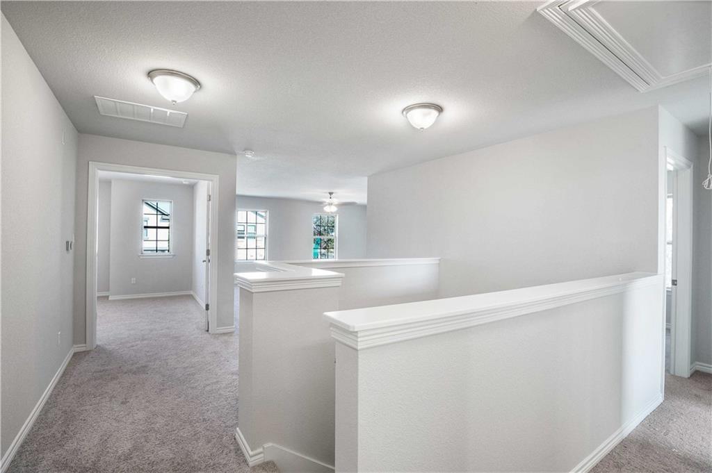 1616 Turtle Bay Loop Leander, TX 78641 - Photo 21 of 33 a view of hallway with wooden floor