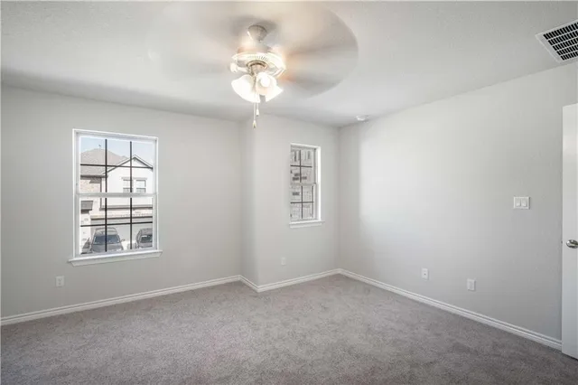 a spacious bathroom with a shower and a sink