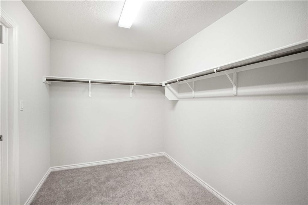 1616 Turtle Bay Loop Leander, TX 78641 - Photo 28 of 33 a view of an empty walk in closet