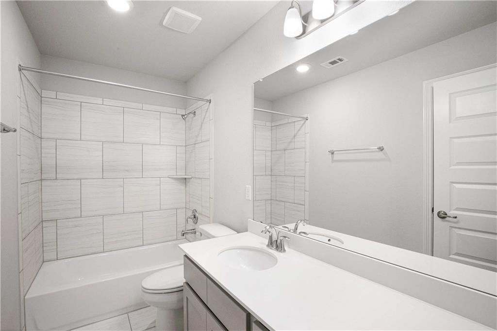 1616 Turtle Bay Loop Leander, TX 78641 - Photo 29 of 33 a bathroom with a sink toilet tub and shower