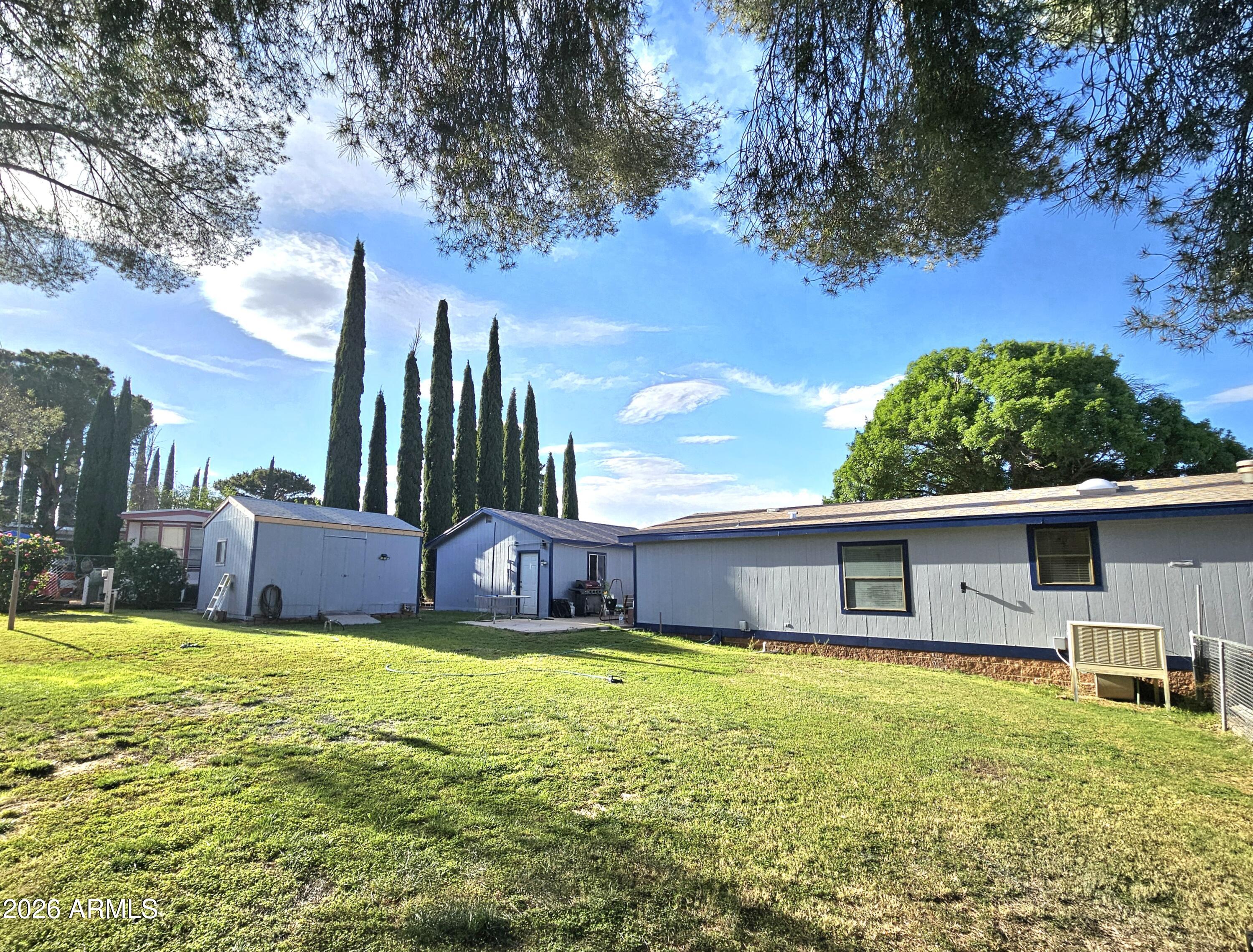 3145 West Citrus Road Benson, AZ 85602 - Photo 11 of 36 a view of a house with a yard