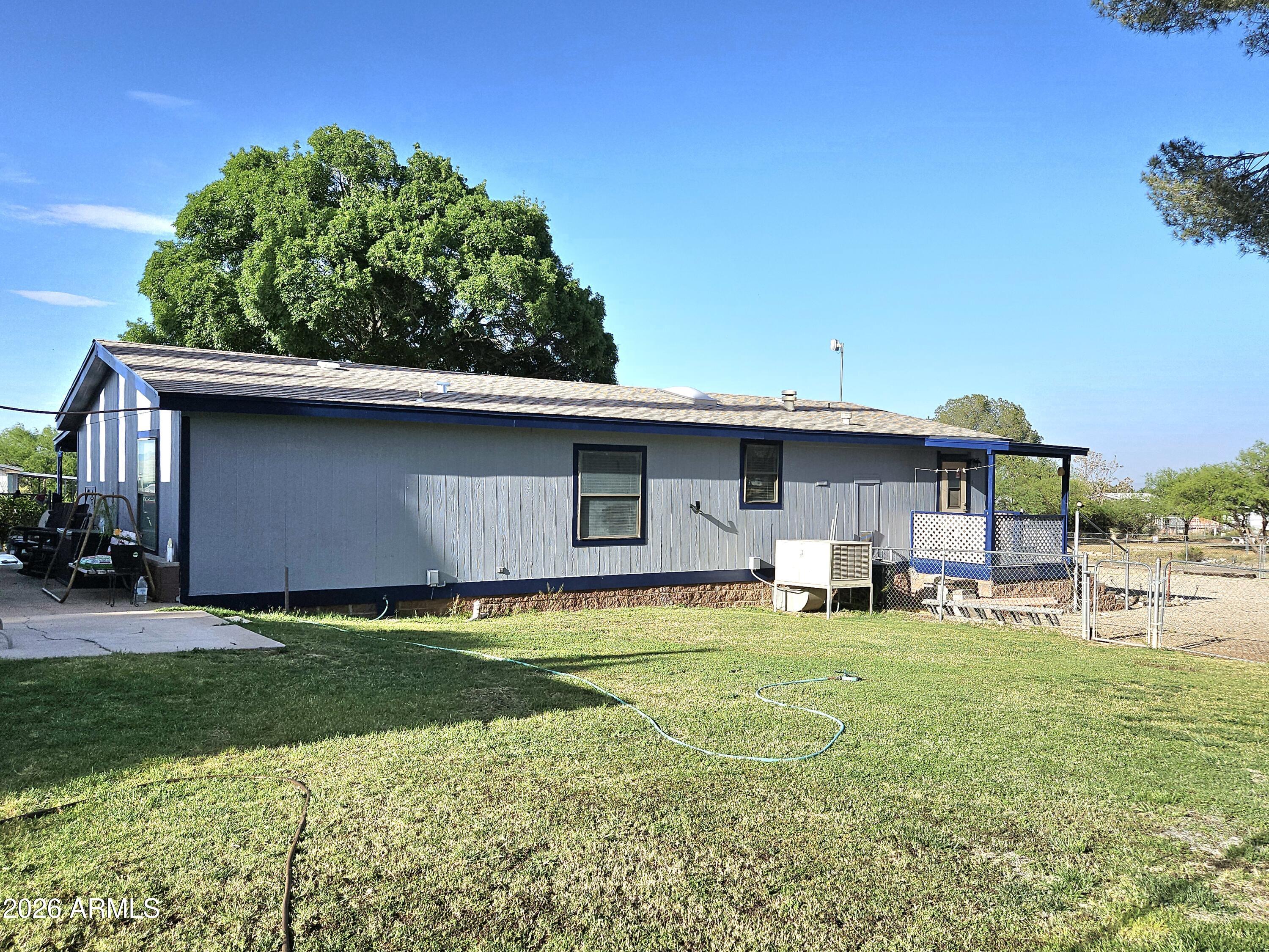 3145 West Citrus Road Benson, AZ 85602 - Photo 12 of 36 a view of a house with a yard