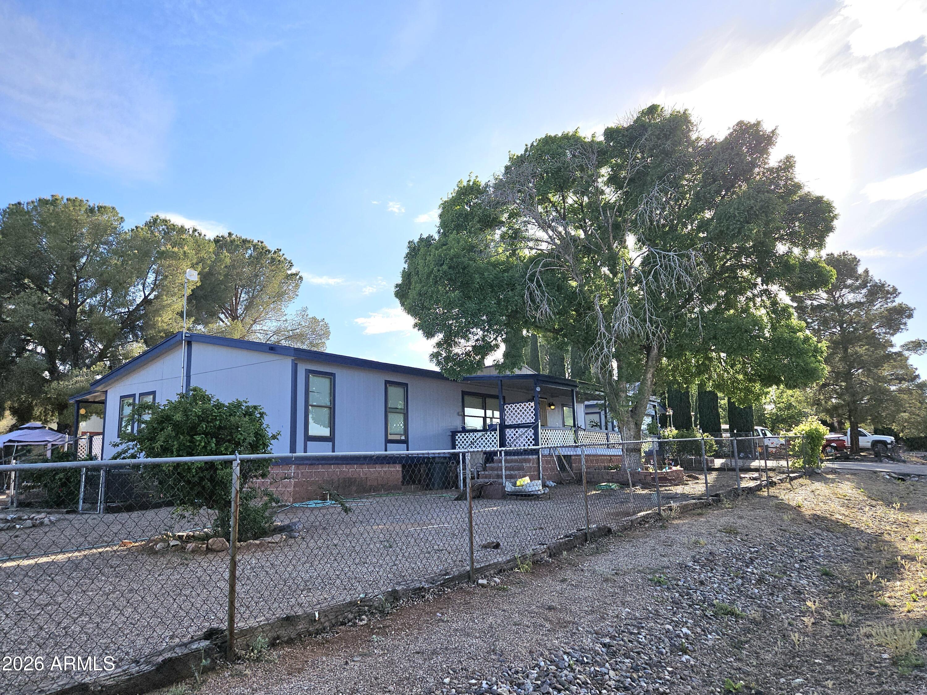 3145 West Citrus Road Benson, AZ 85602 - Photo 31 of 36 a view of a house with backyard