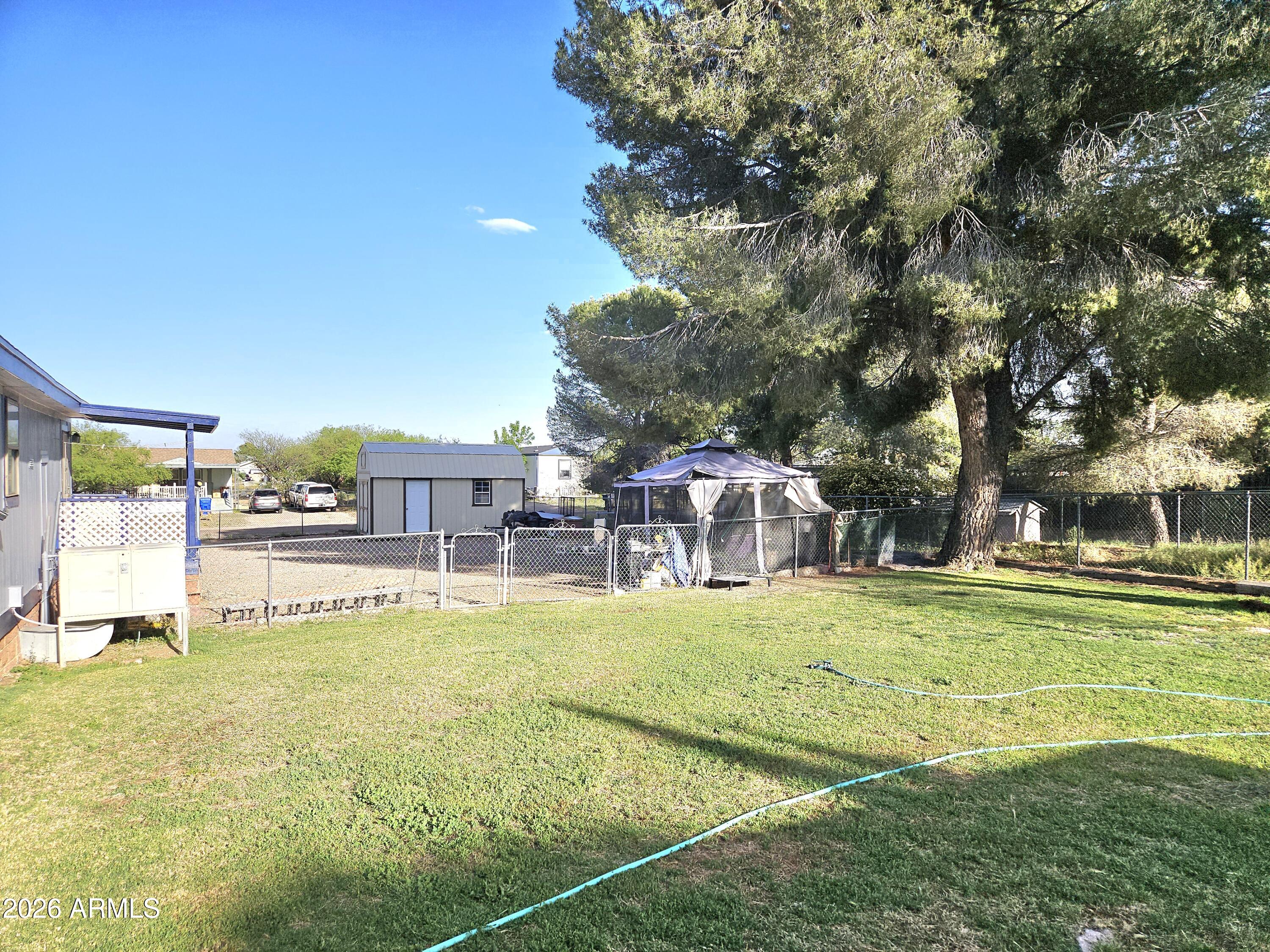 3145 West Citrus Road Benson, AZ 85602 - Photo 35 of 36 a view of a house with a big yard