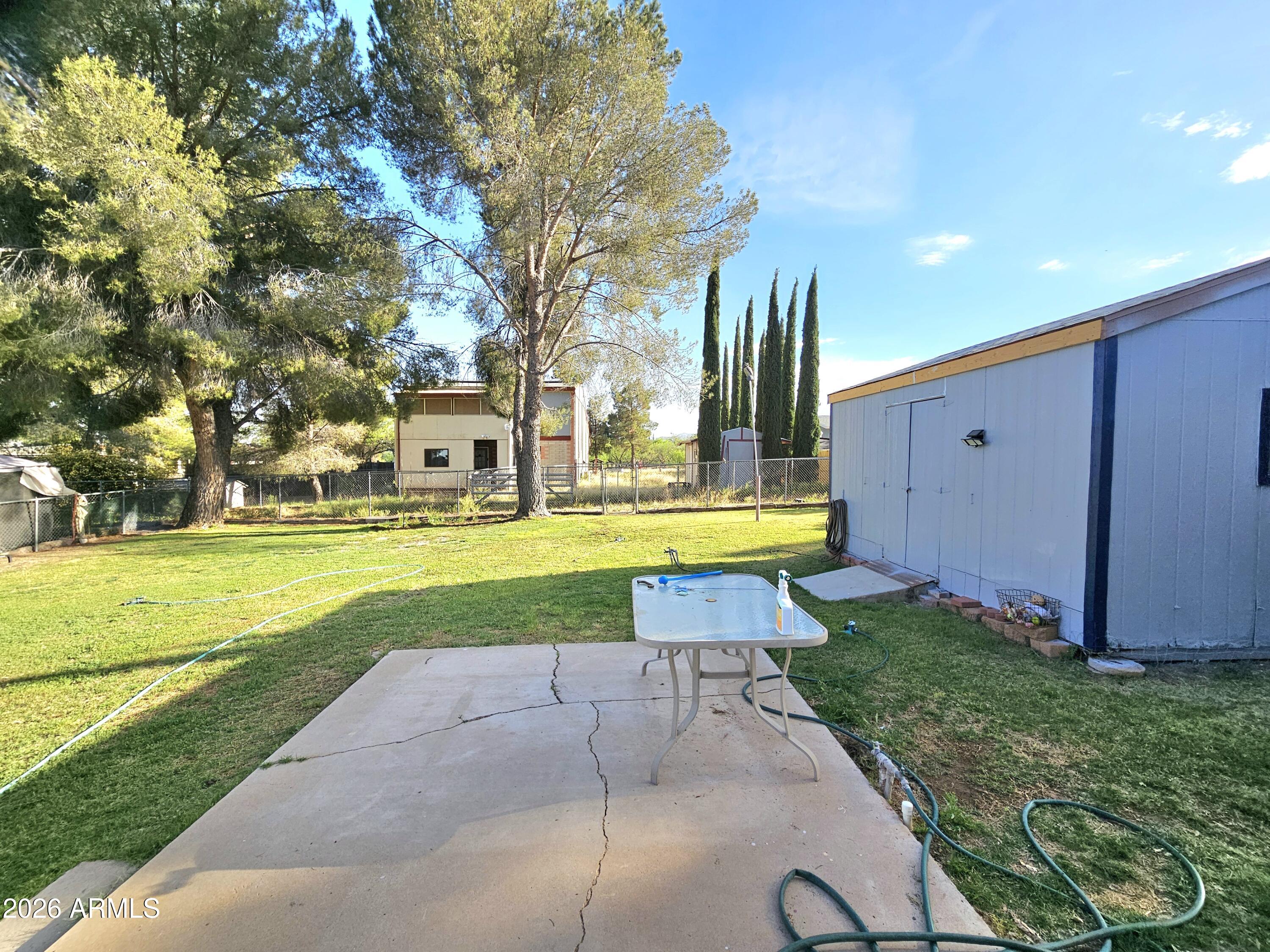 3145 West Citrus Road Benson, AZ 85602 - Photo 36 of 36 a view of a house with a swimming pool