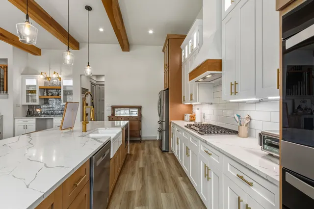 a spacious bedroom with a bed and a cabinets