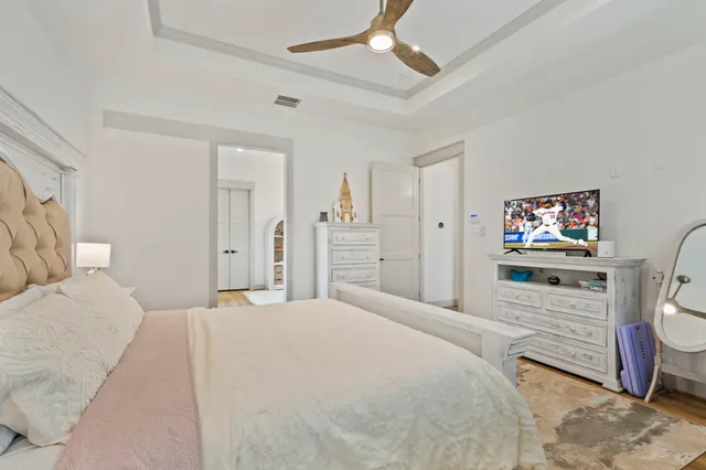 a dining room with furniture and a large window