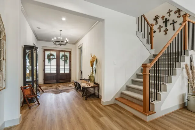 a kitchen with stainless steel appliances granite countertop a stove and cabinets