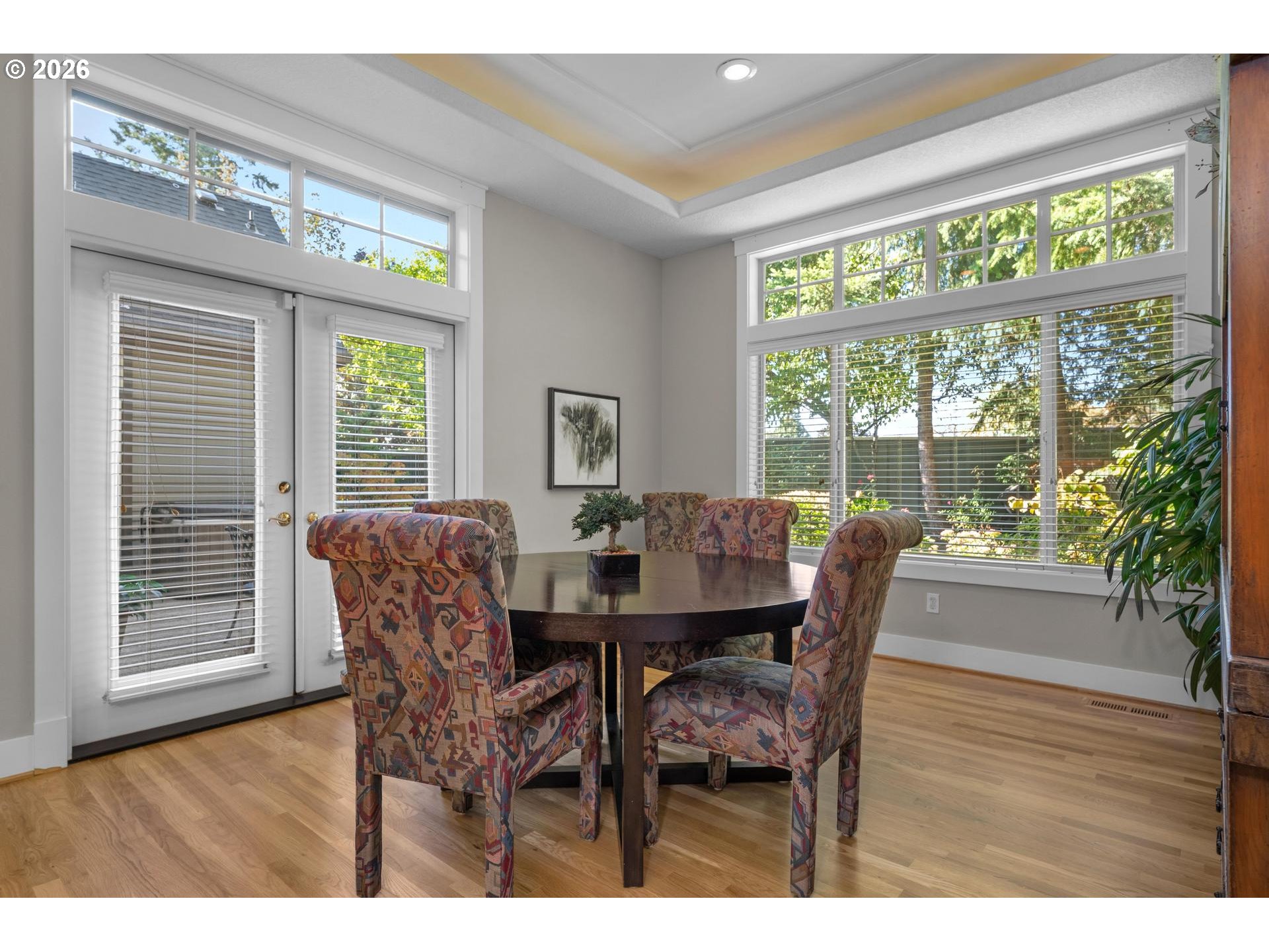 4217 Southwest 64th Court Portland, OR 97221 - Photo 26 of 48 a dining room with furniture a chandelier and wooden floor