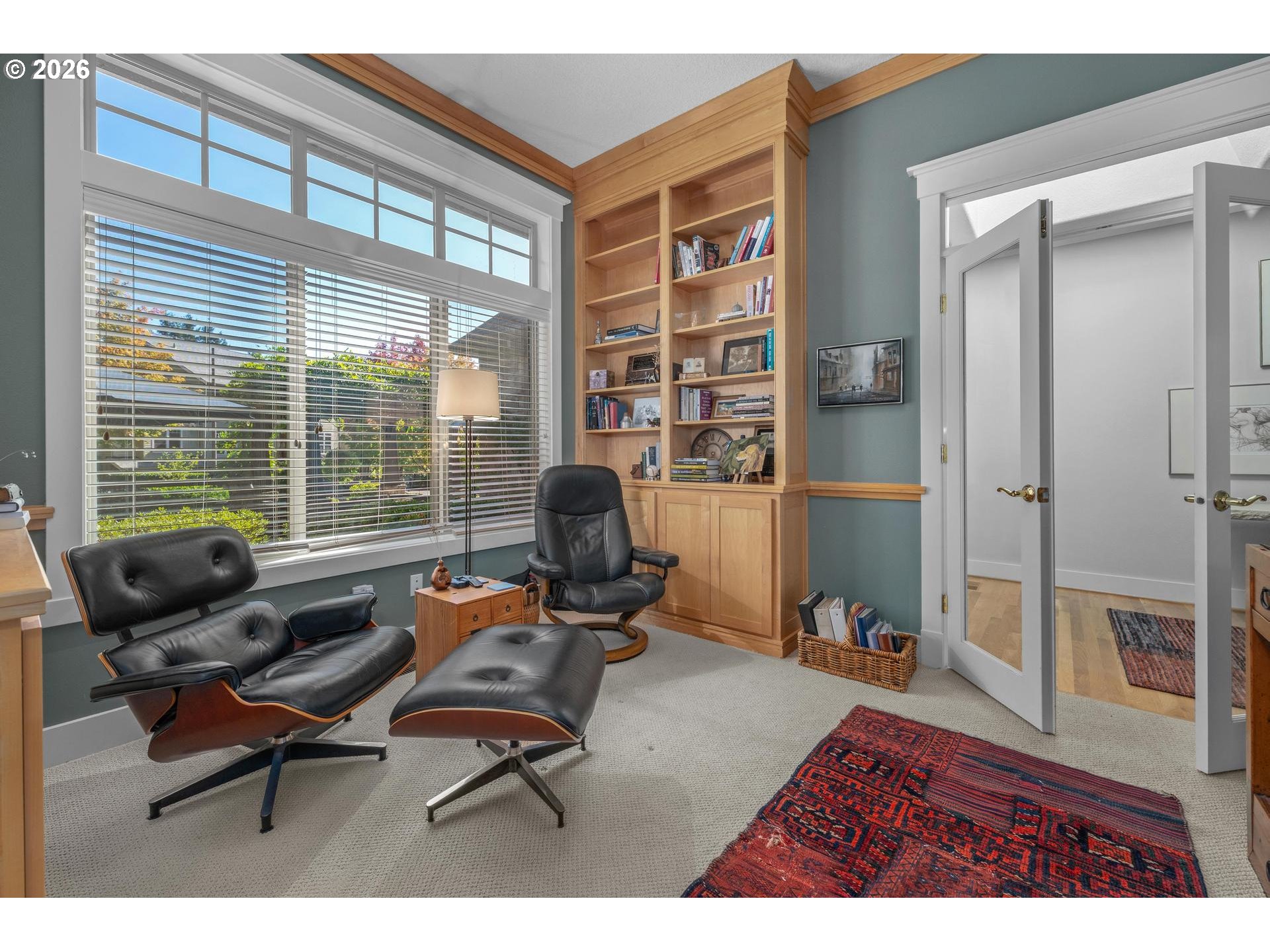 4217 Southwest 64th Court Portland, OR 97221 - Photo 28 of 48 a living room with furniture and a floor to ceiling window