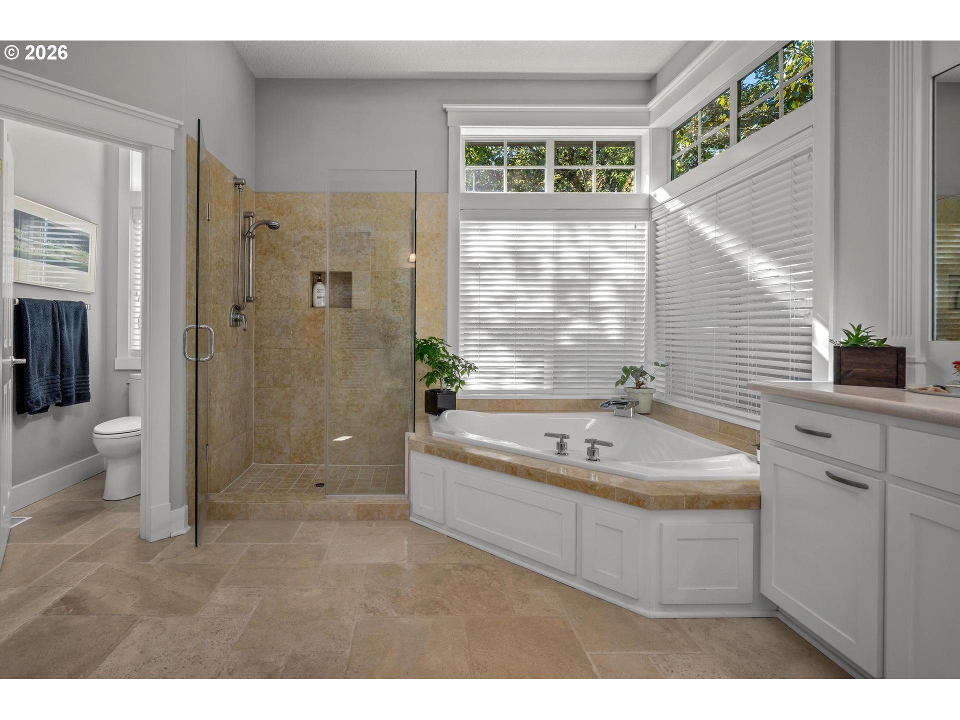 4217 Southwest 64th Court Portland, OR 97221 - Photo 33 of 48 a bath room with a sink a toilet a mirror and a tub
