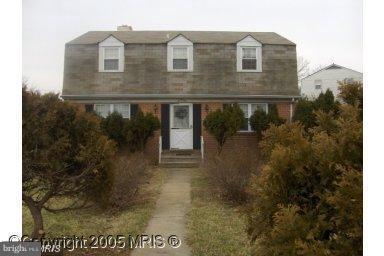 601 Crosby Road Baltimore, MD 21228 - Photo 1 of 16 a view of a brick house with a yard