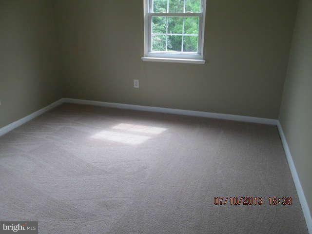 601 Crosby Road Baltimore, MD 21228 - Photo 14 of 16 an empty room with a window