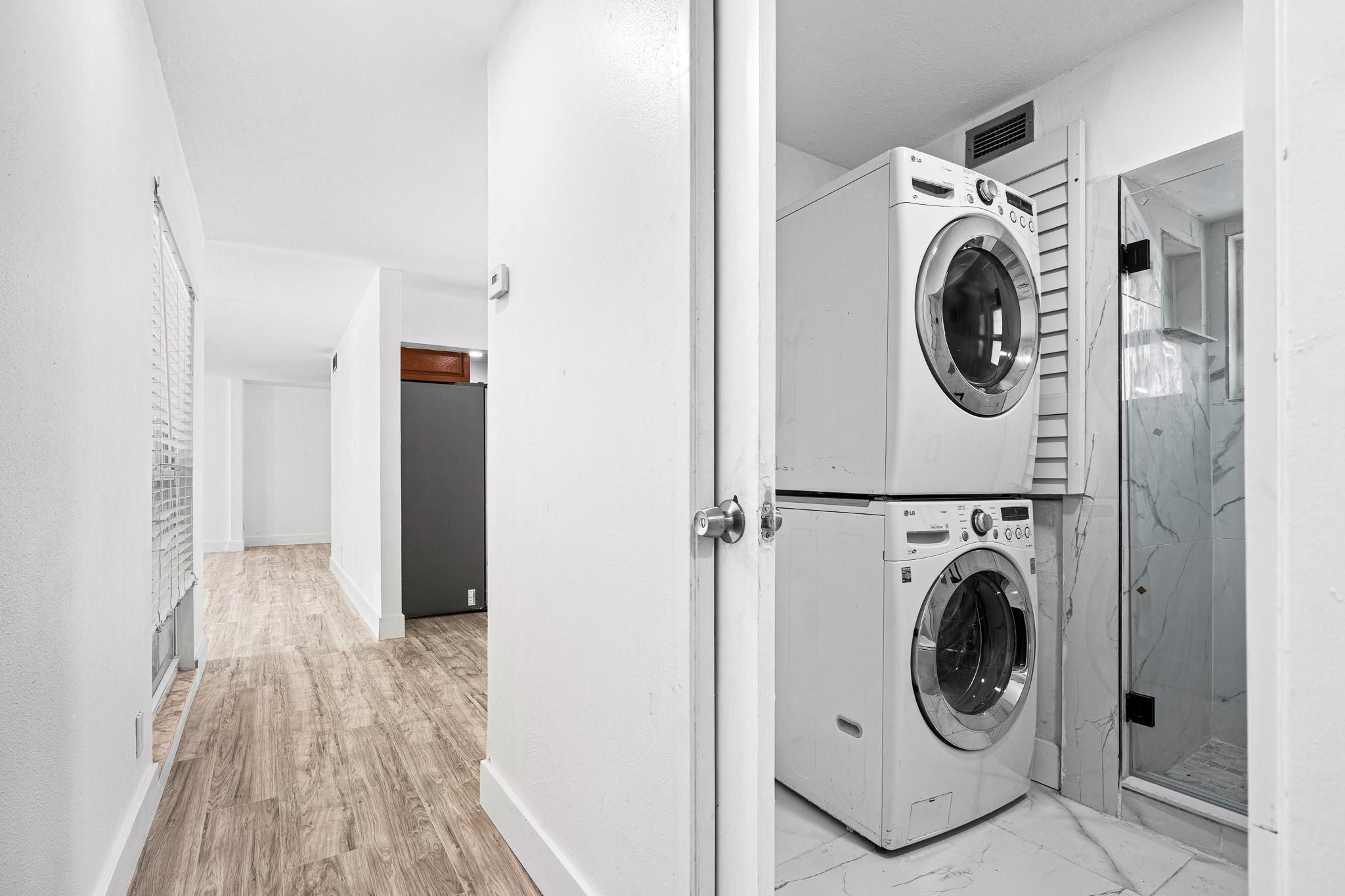 7007 Northwest 64th Street Tamarac, FL 33321 - Photo 12 of 46 a view of a hallway with washer and dryer