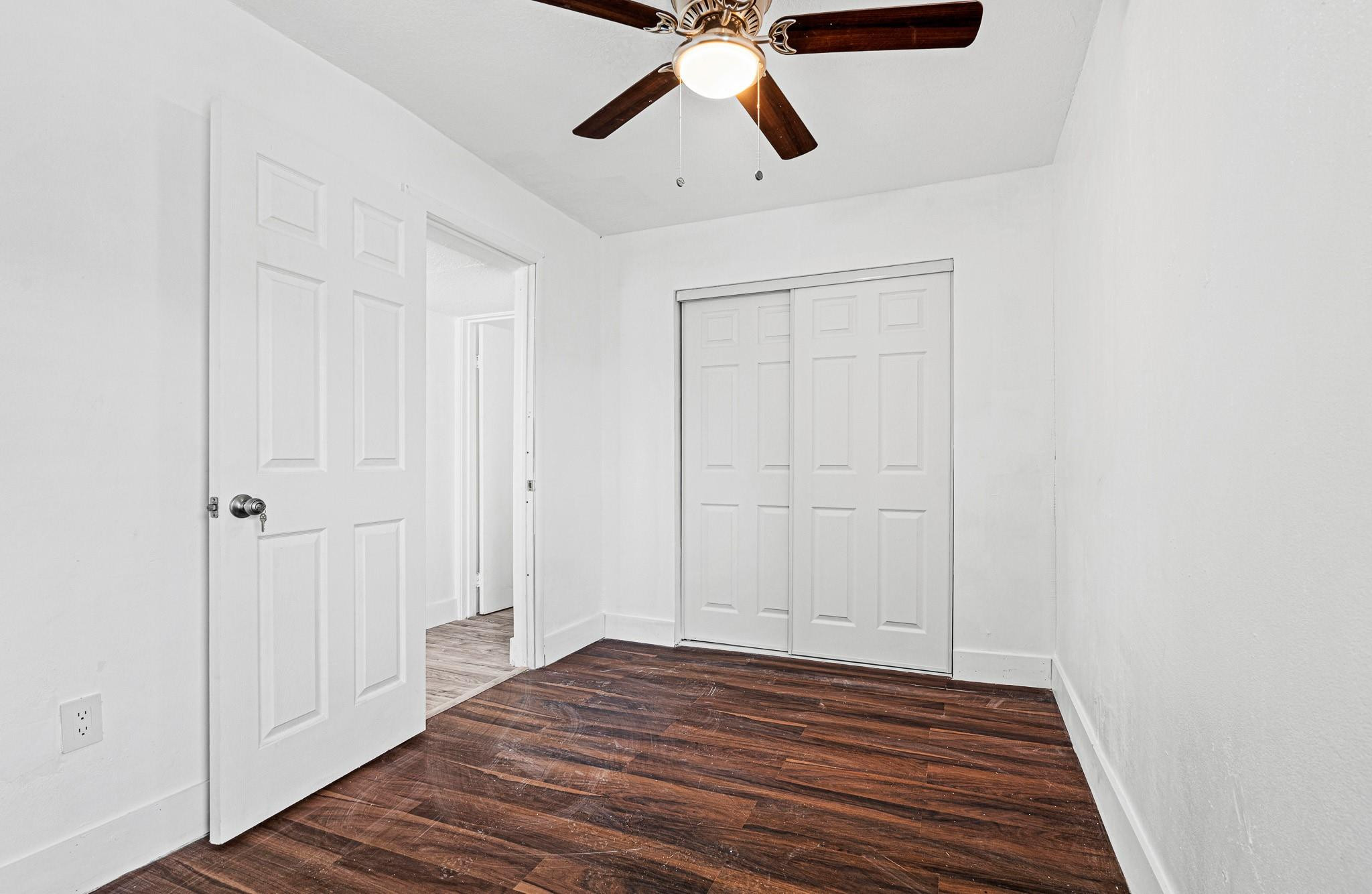 7007 Northwest 64th Street Tamarac, FL 33321 - Photo 14 of 46 a view of empty room with wooden floor