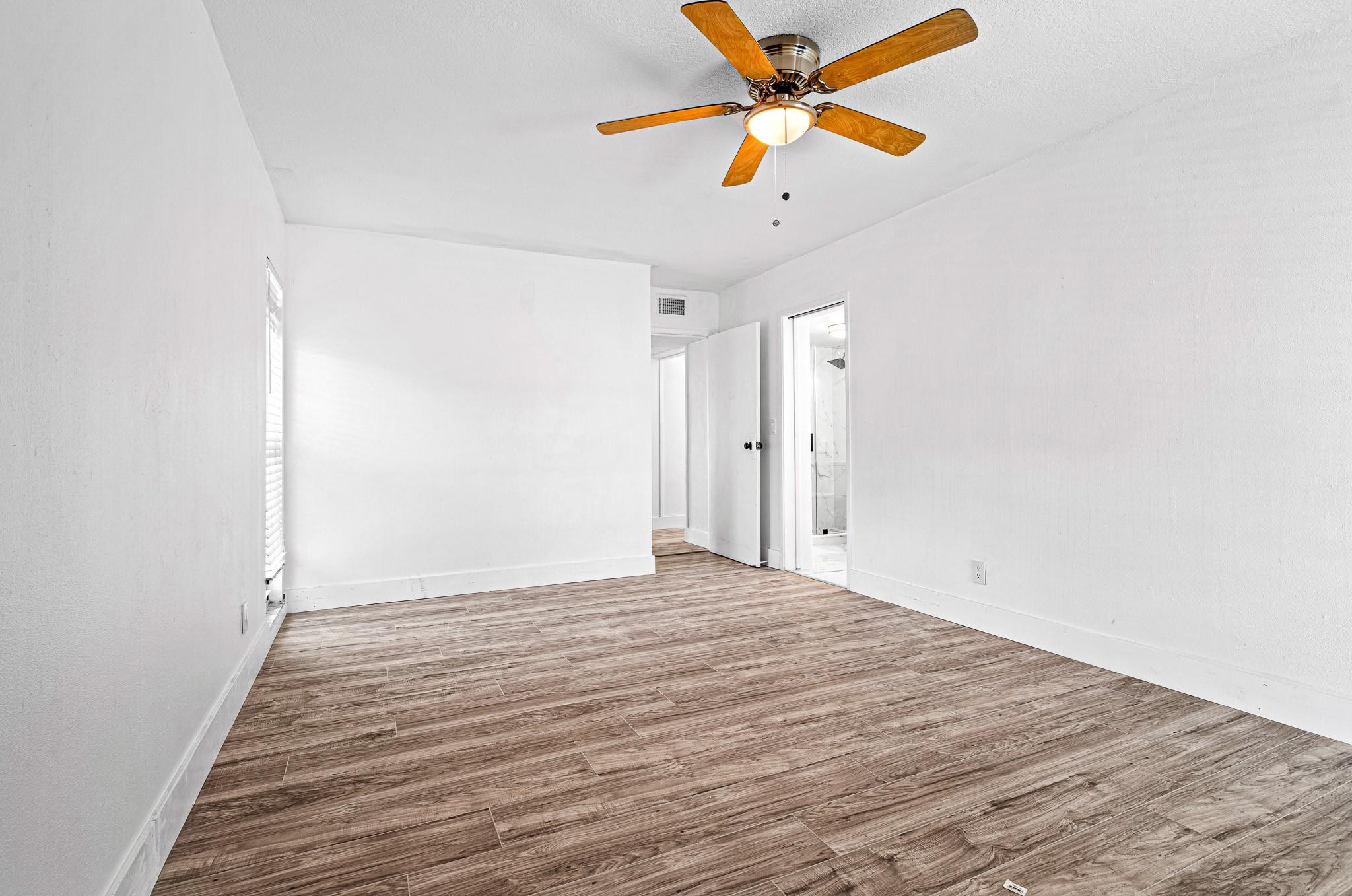 7007 Northwest 64th Street Tamarac, FL 33321 - Photo 19 of 46 wooden floor in an empty room
