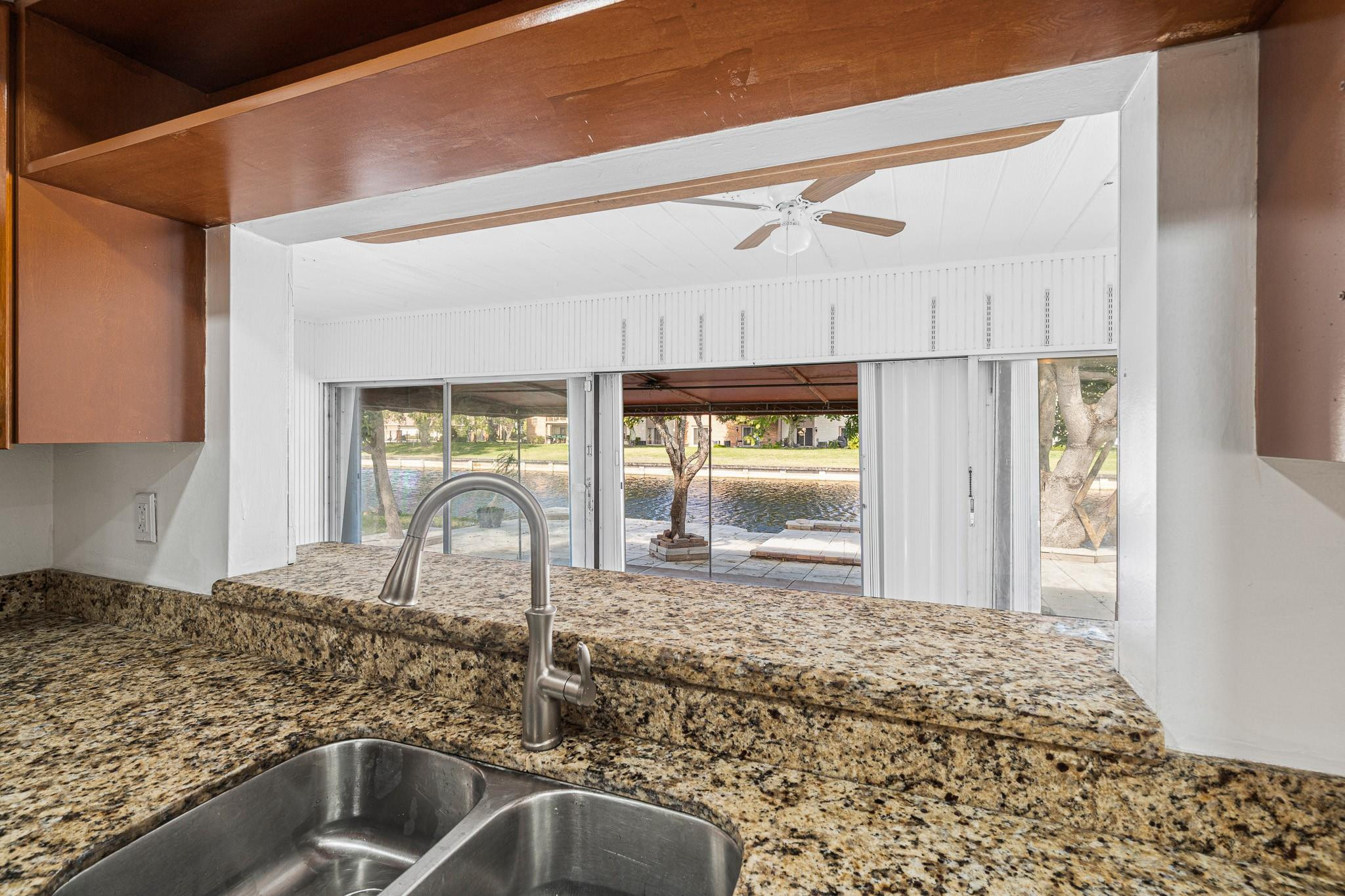 7007 Northwest 64th Street Tamarac, FL 33321 - Photo 25 of 46 a kitchen with a sink and a window