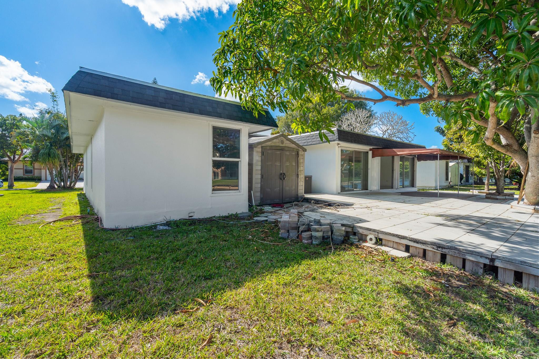 7007 Northwest 64th Street Tamarac, FL 33321 - Photo 28 of 46 a house view with a garden space