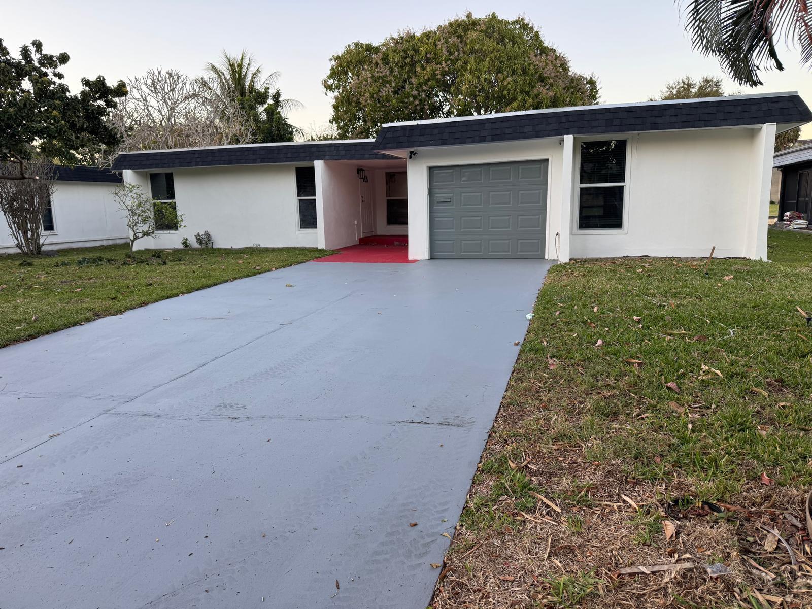 7007 Northwest 64th Street Tamarac, FL 33321 - Photo 38 of 46 a front view of house with yard and trees