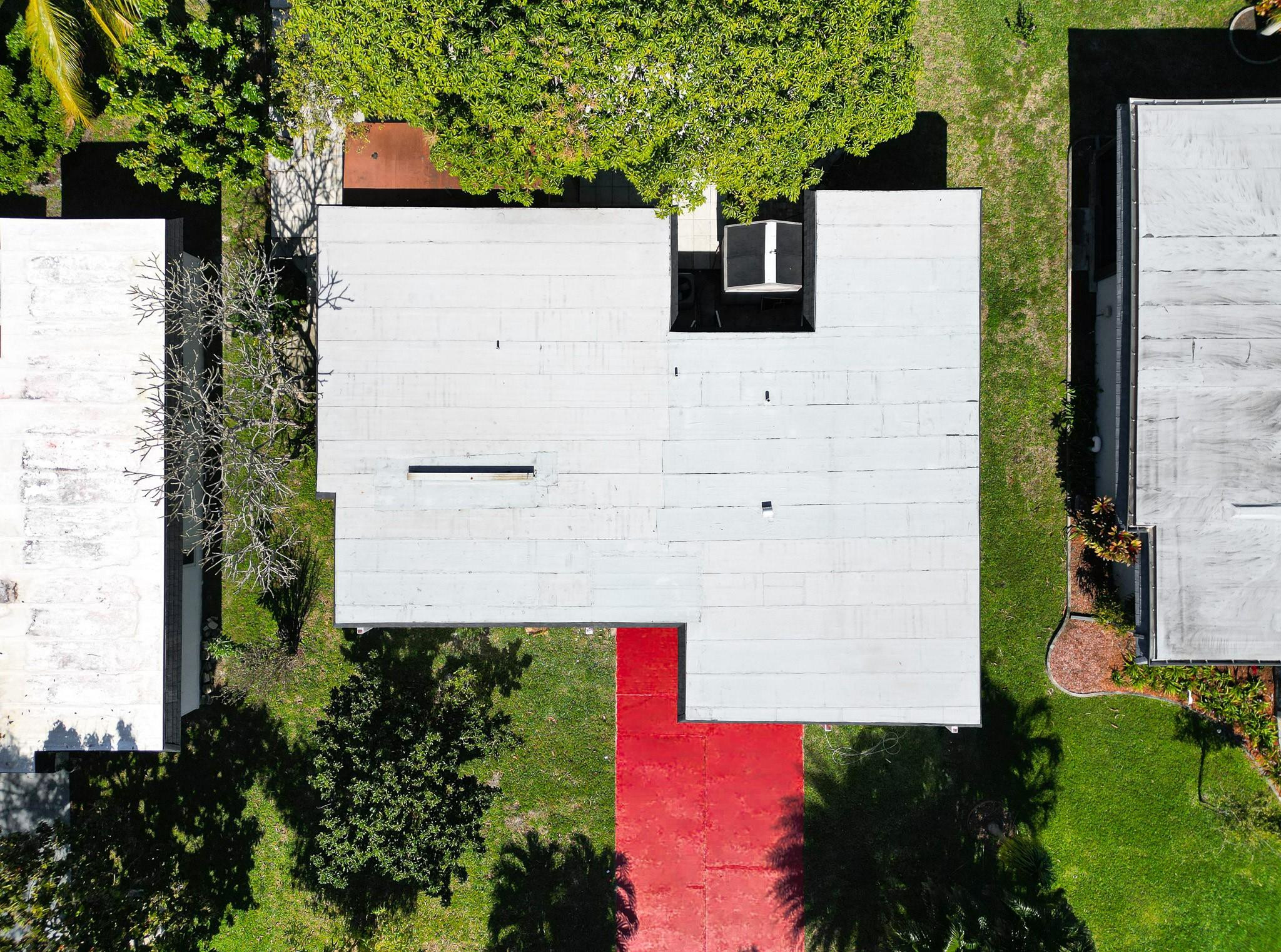 7007 Northwest 64th Street Tamarac, FL 33321 - Photo 4 of 46 an aerial view of a house with a yard