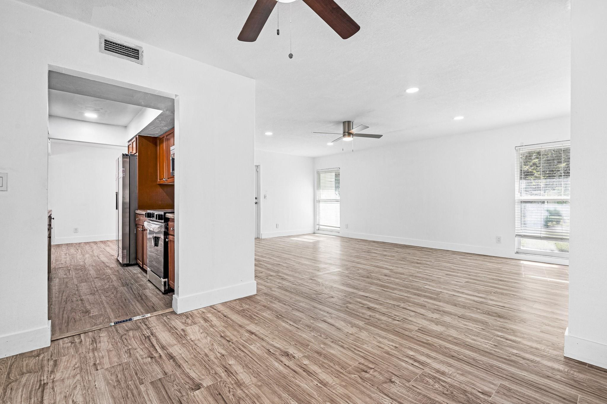 7007 Northwest 64th Street Tamarac, FL 33321 - Photo 9 of 46 a view of empty room with wooden floor