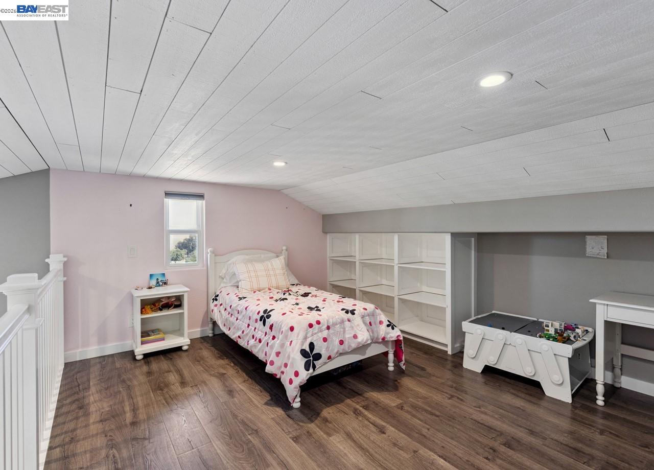 8191 Highland Road Livermore, CA 94551 - Photo 29 of 59 a bedroom with a bed and a chair