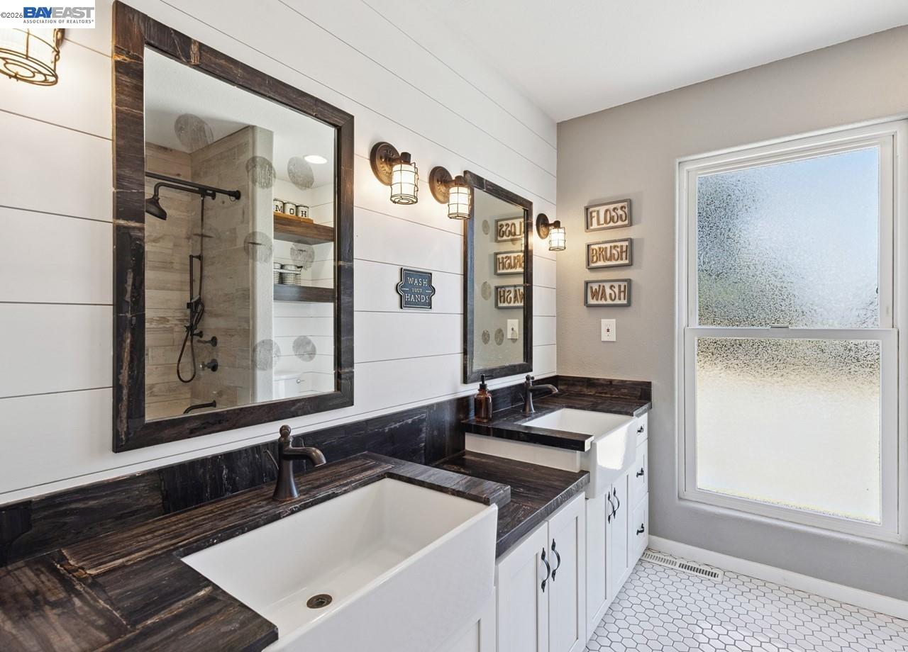 8191 Highland Road Livermore, CA 94551 - Photo 30 of 59 a bathroom with a sink and a mirror