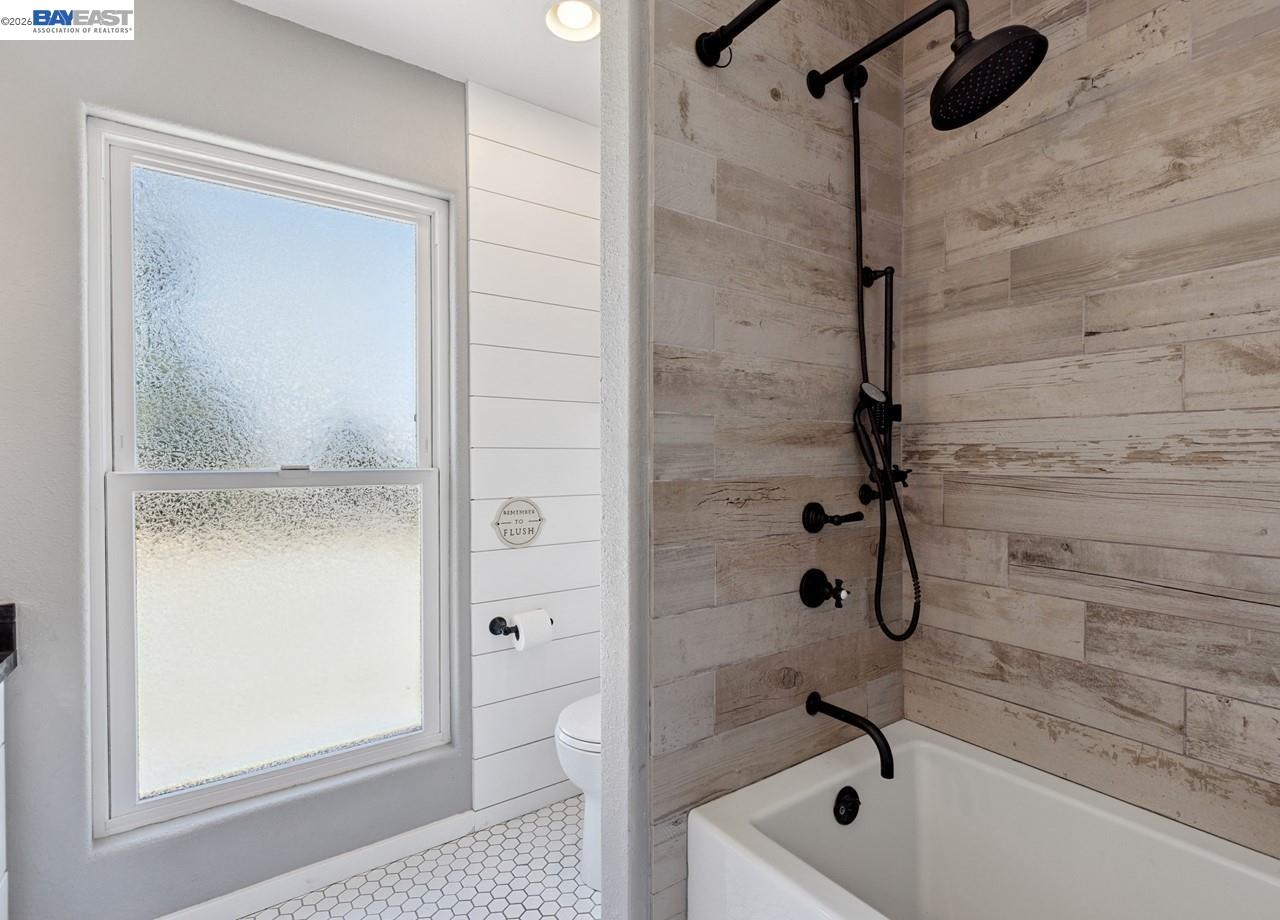 8191 Highland Road Livermore, CA 94551 - Photo 31 of 59 a bathroom with a tub and a shower