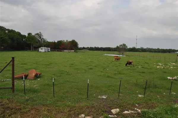 a lake view with a big yard