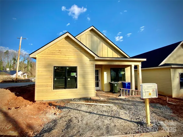 a front view of a house with a porch