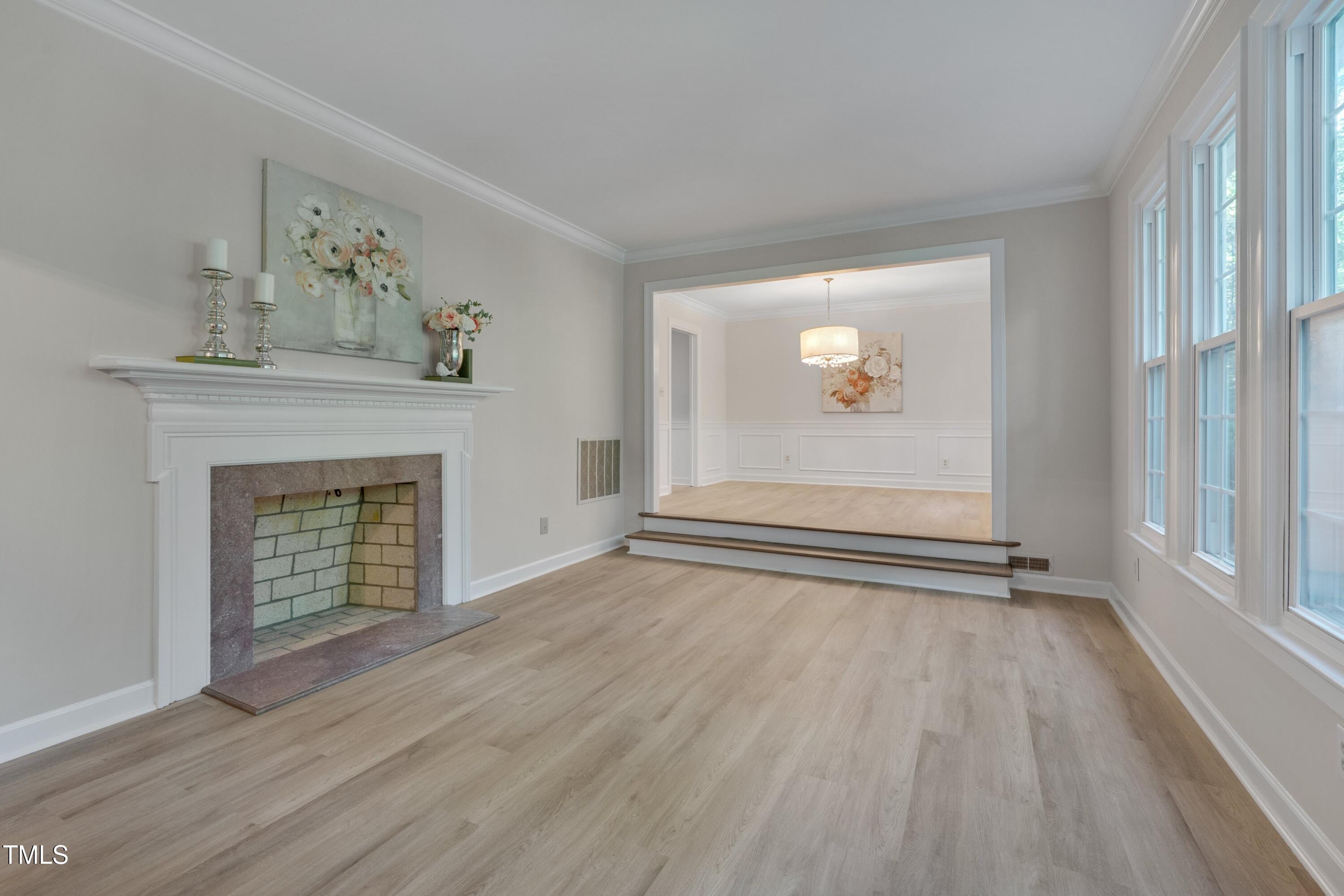 8509 Valley Brook Drive Raleigh, NC 27613 - Photo 4 of 30 Light-filled family room with fireplace and NEW LVP floors