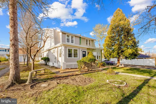 a view of a house with snow on the background