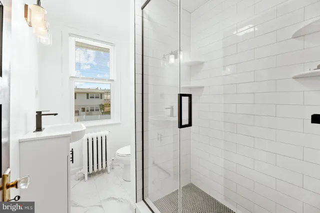 a bathroom with a bathtub and shower