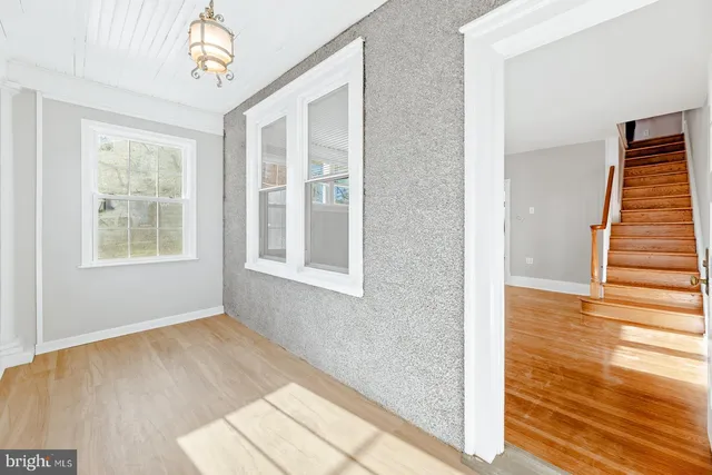 a view of an entryway with wooden floor