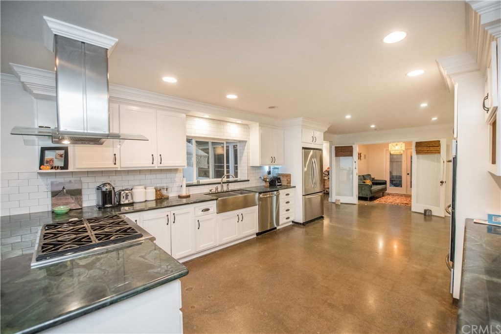 2841 Europa Drive Costa Mesa, CA 92626 - Photo 12 of 30 a large kitchen with stainless steel appliances lots of counter space and a sink