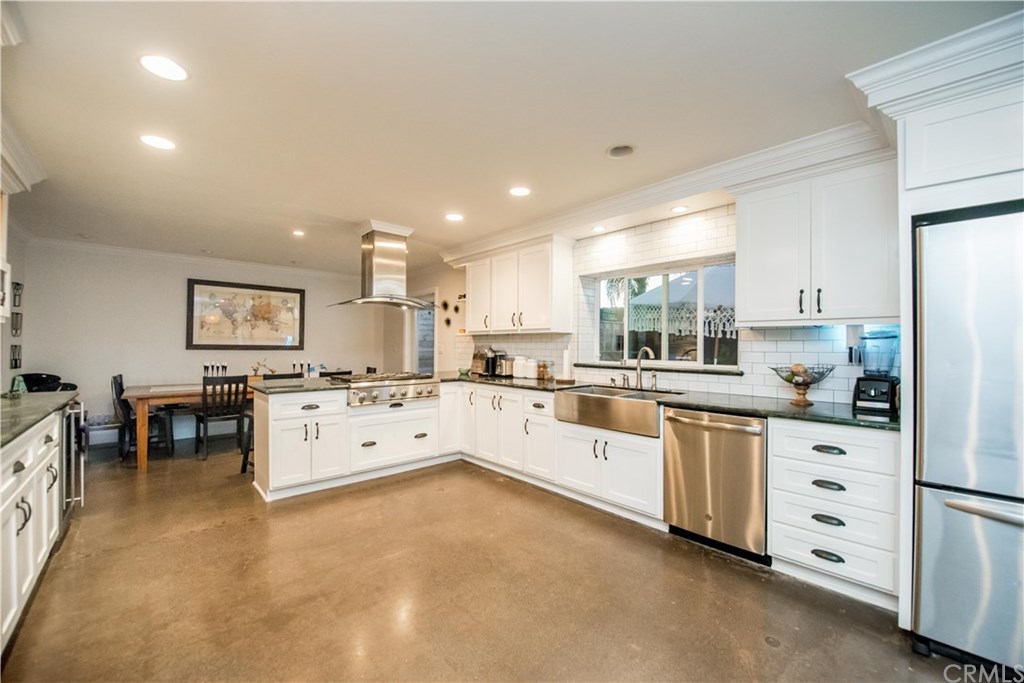 2841 Europa Drive Costa Mesa, CA 92626 - Photo 14 of 30 a large white kitchen with cabinets