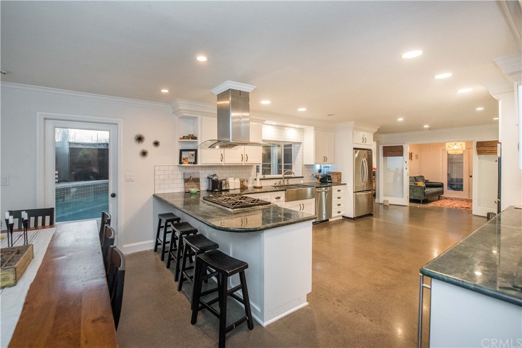 2841 Europa Drive Costa Mesa, CA 92626 - Photo 16 of 30 a kitchen with stainless steel appliances kitchen island granite countertop a sink and cabinets
