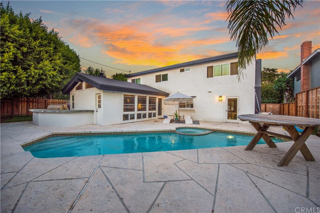 2841 Europa Drive Costa Mesa, CA 92626 - Photo 2 of 30 a view of backyard of house with outdoor seating and green bushes