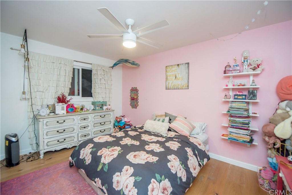 2841 Europa Drive Costa Mesa, CA 92626 - Photo 21 of 30 a bedroom with a bed and a dresser in it