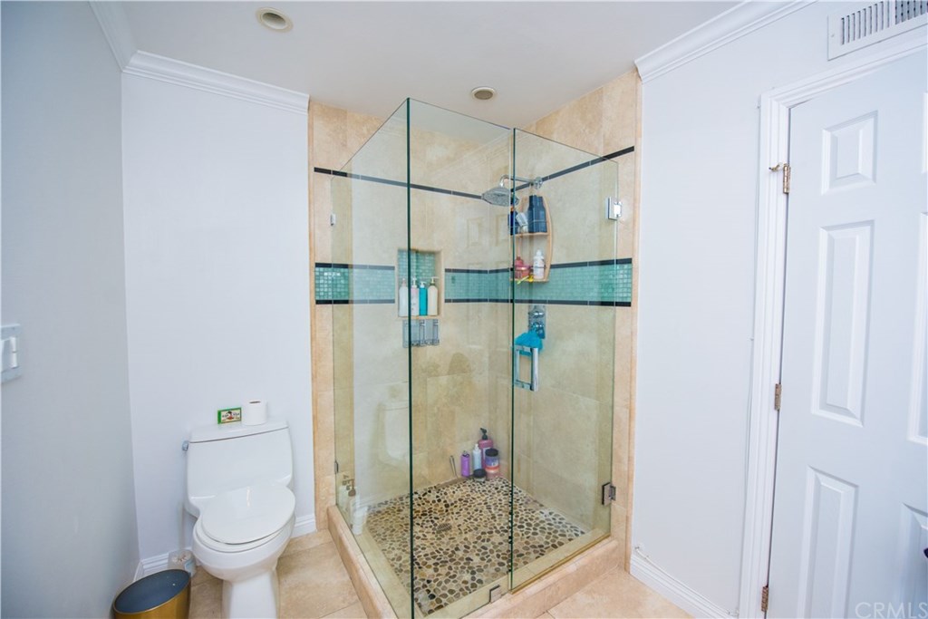 2841 Europa Drive Costa Mesa, CA 92626 - Photo 22 of 30 a bathroom with a shower and toilet