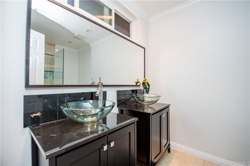 2841 Europa Drive Costa Mesa, CA 92626 - Photo 25 of 30 a bathroom with a sink and a mirror