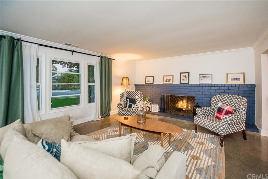 2841 Europa Drive Costa Mesa, CA 92626 - Photo 8 of 30 a living room with furniture and a fireplace
