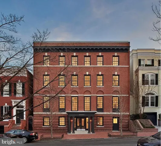 a front view of a building with many windows