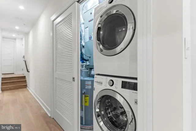 a view of a hallway with washer and dryer