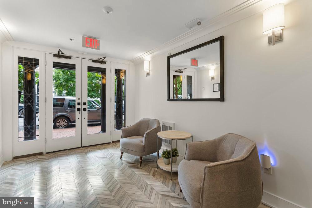 3016 Dumbarton Street Northwest, Unit 102 Washington, DC 20007 - Photo 5 of 23 a living room with furniture and a floor to ceiling window