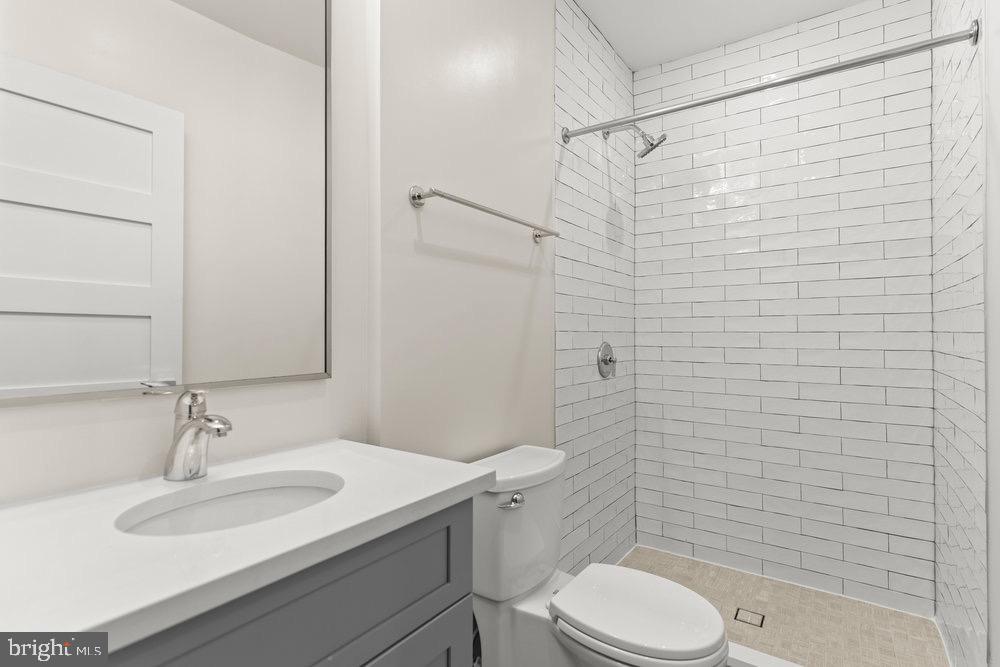 3016 Dumbarton Street Northwest, Unit 102 Washington, DC 20007 - Photo 9 of 23 a bathroom with a sink a toilet and shower