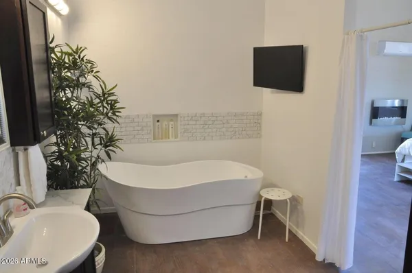 a bathroom with a sink and mirror